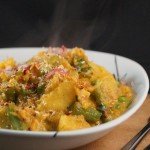 Sri Lankan Sweet Potato & Pea Curry served with Saffron and Turmeric Basmati Rice and topped with Coconut Sambal