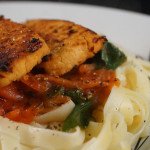 Tagliatelle with Balsamic & Chili Marinated Tofu Pan Seared and served with a Roasted Cherry Tomato & Spinach